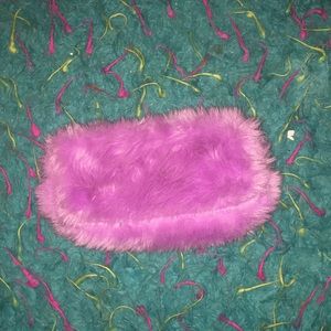 A fluffy purple zipper pouch